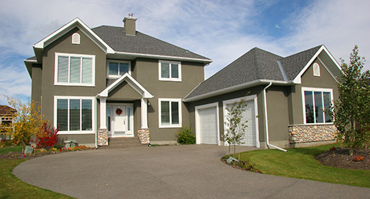 Exterior shot of a large house from the driveway (1)