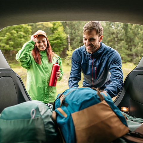 /getmedia/4c400a17 2c3d 44bc bdf3 f158b638b15f/couple packing their car with hiking gear_1