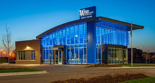 Exterior view of Maple Grove branch lit up at night