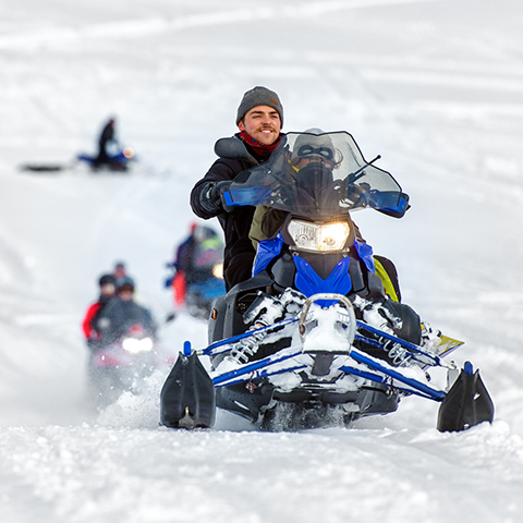group of friends riding snowmobiles_480x480